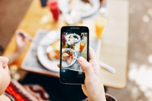 taking a photo of food with phone